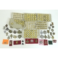 Over one hundred and fifty British army badges and Royal Navy buttons, with approximately forty cap ... 
