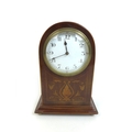 An Edwardian mahogany mantle clock, the domed topped case with decorative marquetry inlay, white Ara... 