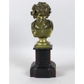A Neo-Classical gilt metal bust of a young man, his hair festooned with berries and leaves, unsigned... 