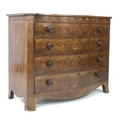An early Victorian figured mahogany serpentine fronted chest of four graduating drawers, the shaped ... 