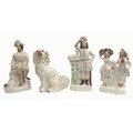 A group of four Victorian flatback Staffordshire figurines, including one titled 'The Lion Slayer', ... 