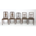 A group of Edwardian mahogany chairs, one with carved frame, a pair with inlaid splat, and another p... 