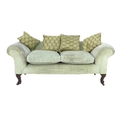 A modern Chesterfield style two seater settee, with scroll over arms and back, the front legs carved... 