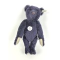 A 1998 Steiff replica 1909 dark blue teddy bear, 35cm high with growler, a certificate numbered 2623... 