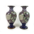 A near pair of Royal Doulton stoneware 'Roses' pattern vases, of baluster form, with rose decoration... 
