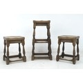 Three 1920s oak stools, comprising a pair, 35 by 40.5 by 77cm high, and taller single stool, 31 by 3... 