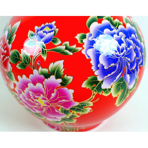 15 - A large modern Chinese porcelain double gourd vase, with printed floral decoration against a red gro... 