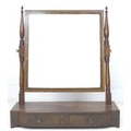 A late Georgian mahogany toilet mirror, with two drawers to bow fronted base, 61.5 by 23.5 by 71cm h... 