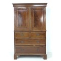 An Edwardian mahogany press cupboard, in George III style, with line inlay and crossbanded decoratio... 