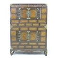 An early 20th century Chinese storage cabinet, of brick front design with brass corners and handles,... 