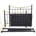 A Victorian brass and iron double bed frame, with brass ball finials and black painted spindle rail ... 