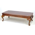 A modern walnut veneered coffee table, with crossbanded decoration, carved frieze and cabriole legs,... 