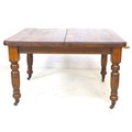 A late Victorian oak extending dining table, with two additional leaves, 29cm and 30cm, carved balus... 