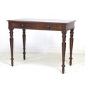 A mid Victorian mahogany side table, with moulded surface, two frieze drawers with turned handles, r... 