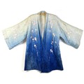 An early 20th century Japanese haori padded jacket, embroidered in silk with white and pink flowered... 