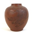 A Chinese Yixing pottery vase, incised decoration to one side with a dragon descending from the clou... 