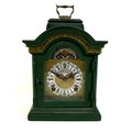 A vintage Dutch John Warmink mantel clock, with green painted case and brass carry handle, 8 day mov... 