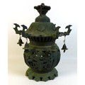 A Chinese bronze lantern, early to mid 20th century, of ovoid bodied form with pagoda style roof, th... 