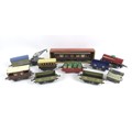 A collection of Hornby 0 gauge rolling stock, wagons, and other accessories, including a crane wagon... 