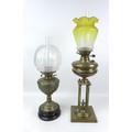 Two Victorian brass paraffin lamps, one with brass reservoir and unusual base with four column on a ... 