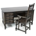 An Ercol dark stained oak five drawer pedestal desk, circa 1980, 'Writing Desk', model 696, in Old C... 