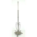 A late Victorian brass telescopic standard lamp, with circular floral embossed foot and three decora... 