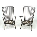A pair of Ercol dark stained armchairs, 'Tall Back Easy Chair', model 478, in Old Colonial Antique c... 