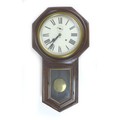 An early 20th century Ansonia drop dial wall clock, with Roman numeral dial, with pendulum, a/f, 43 ... 