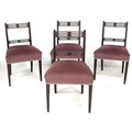 A set of four Regency mahogany dining chairs, each with pierced decoration to top rails, upholstered... 
