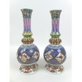 A pair of Meissen style baluster vases, both with profuse floral decoration, with Messen style marks... 