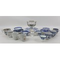 A collection of sixteen European and Oriental porcelain, including a blue and white tea bowl with sa... 
