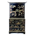 A mid to late 20th century Chinoiserie press cupboard, in George III style, with black lacquer and g... 