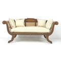 A modern tropical wood bergere settee, with carved frame and scroll arms, caned seat, sides and back... 