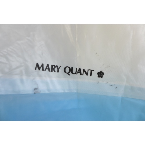 73 - A Mary Quant poncho rain cape, circa 1980s, in blue and white PVC, with hood and front central pocke... 