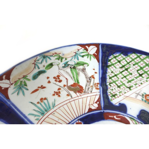 22 - A 19th century Japanese Imari charger, decorated with a fan and origami bird to the centre, 37cm dia... 