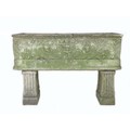 An early 20th century carved stone garden planter, of open coffin form with two drainage holes, deco... 