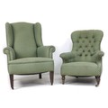 A mid 20th century wing back armchair, with tapered legs, upholstered in green diamond patterned fab... 