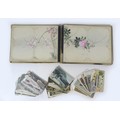 An early 20th century Chinese album with hand painted silk lined pages, a/f, with single lacquered b... 