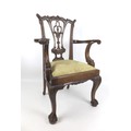 A diminutive reproduction mahogany Chippendale style open armchair, late 20th century, with ornately... 