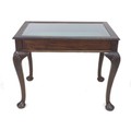 An Edwardian bijouterie table, of rectangular form, glazed lift lid, raised on four cabriole legs wi... 