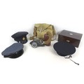 A WWII Mk 4 gas mask bearing '1940' an associated cloth case, three military caps, and a Victorian r... 