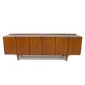 A British teak sideboard, Robert Heritage for Archie Shine, of long low form with small shaped upsta... 
