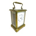 A 19th century brass carriage clock, five glass case, 8 by 6.5 by 12cm high (with handle down), in l... 