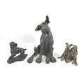 A group of three modern canine sculptures, bronze resin, a larger one of a sitting terrier, 26 by 25... 