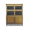 A 1930's glazed mahogany bookcase, by Minty Limited, Library Specialists, Oxford, with two leaded gl... 