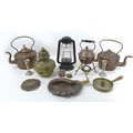 A group of copper and brass items, including an embossed kettle, burner and stand, a crumb brush and... 