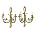 A pair of French gilt metal wall sconces, twin branch with scrolling decoration, each 31 by 15 by 49... 