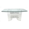 A modern design dining table, shaped rectangular clear glass surface with bevelled edge raised on tw... 