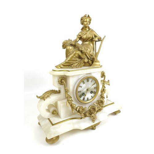 177 - A late 19th century French alabaster and gilt metal figural mantel clock, adorned with female figure... 