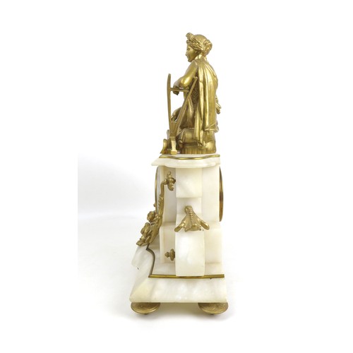 177 - A late 19th century French alabaster and gilt metal figural mantel clock, adorned with female figure... 